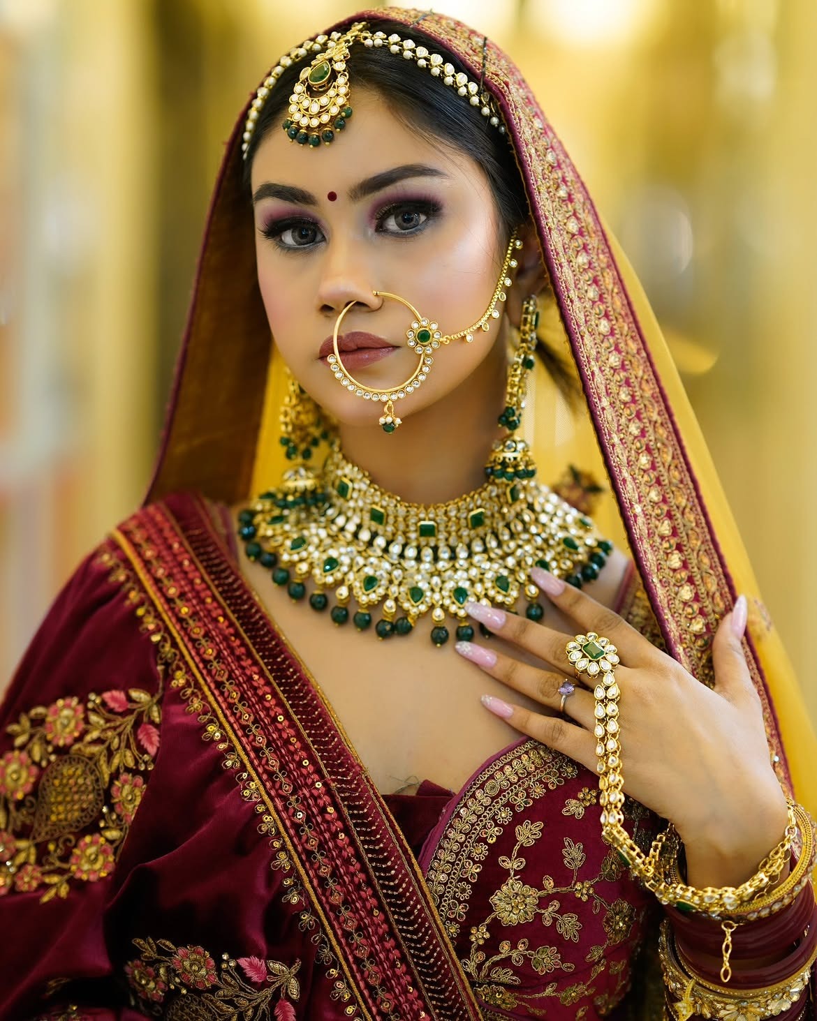 Bridal portrait with an ornate red veil