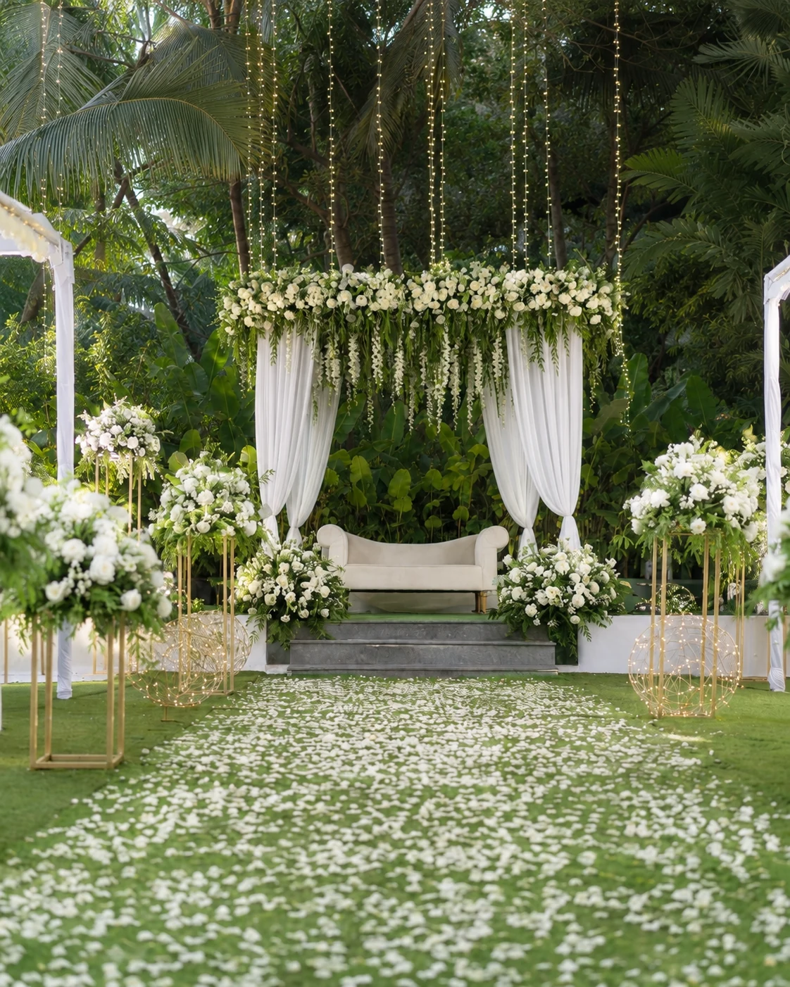 Celebria's delivered white floral canopy with a ceremony aisle and hanging lights
