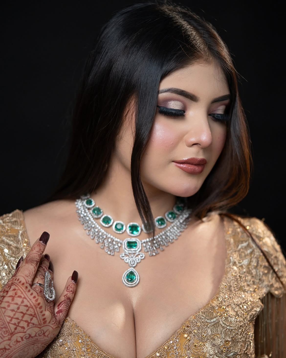 Close-up of bridal jewellery and henna